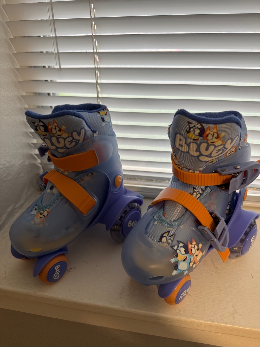 Blue Kids Adjustable Roller Skates with Orange Straps